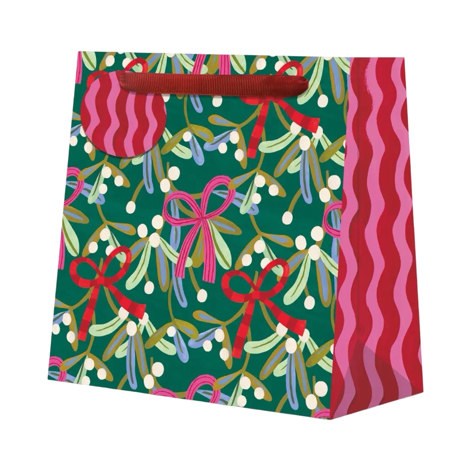 Christmas-themed gift bag with ribbons and mistletoe pattern on a green background