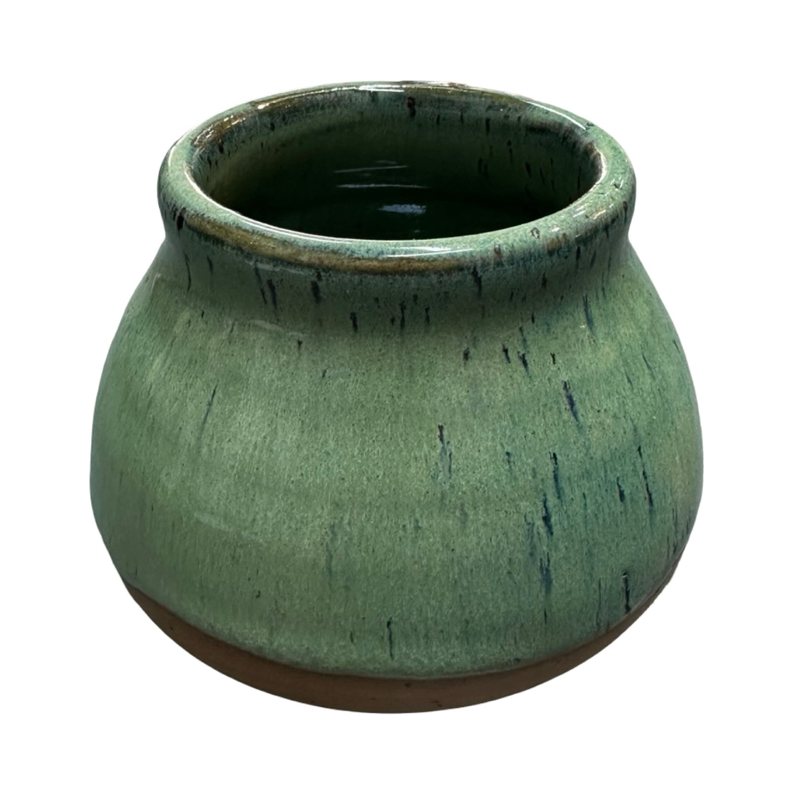 Green ceramic mug with a textured surface on a white background.