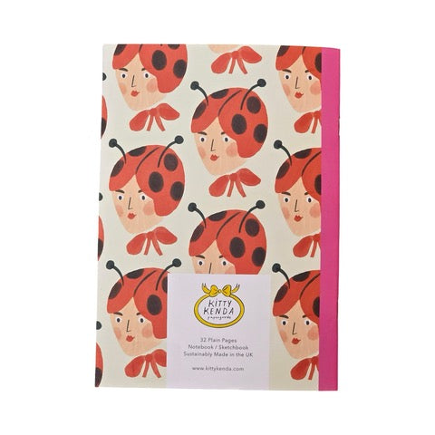 These gorgeous notebooks feature a lady's head wearing a ladybird hat and a large red bow around her neck.