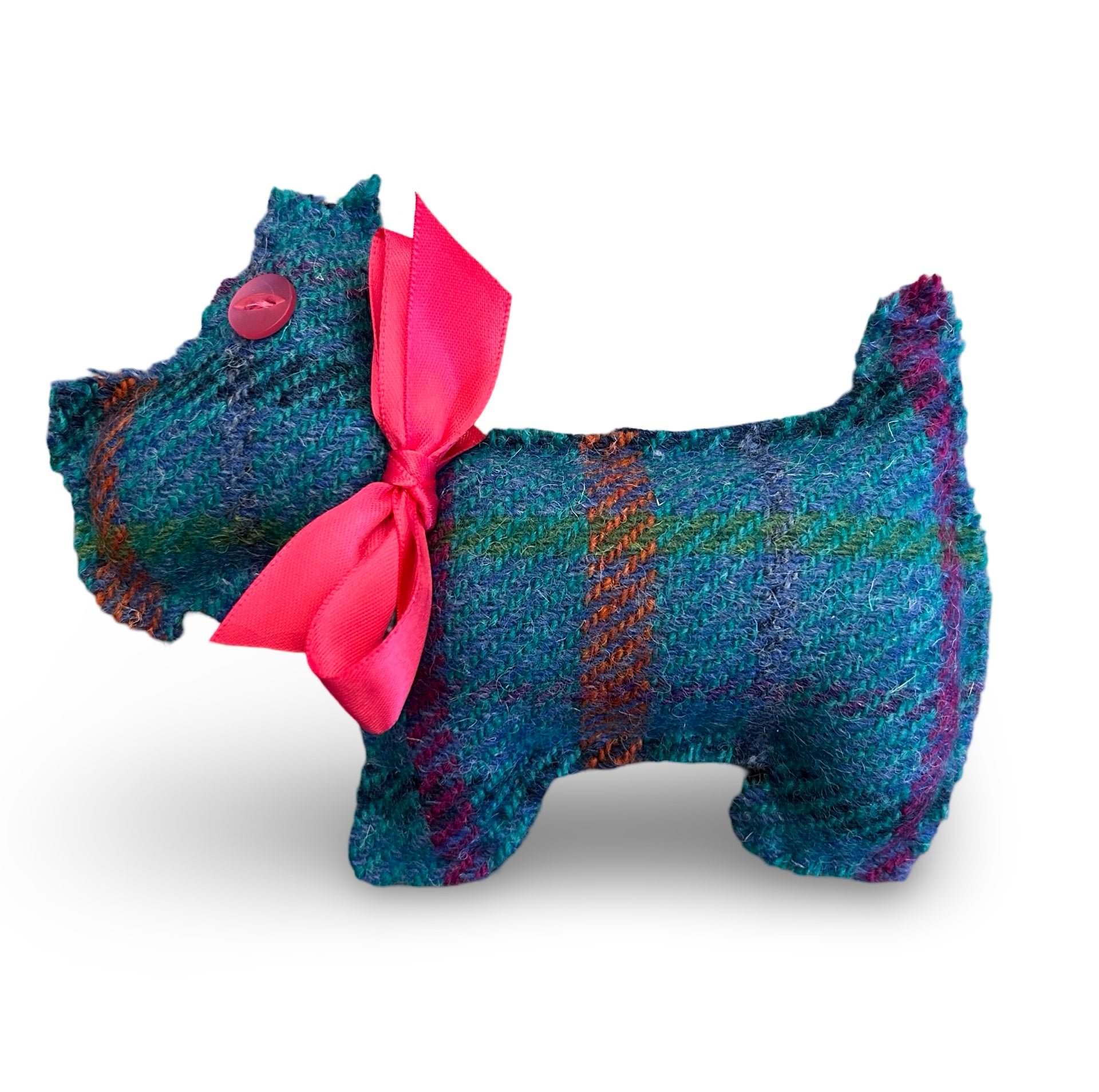 Hand sewn Scottie Dog shaped lavender sachet in turquoise Harris tweed. The Scottie dog has a pink button eye and a bright pink satin ribbon collar.