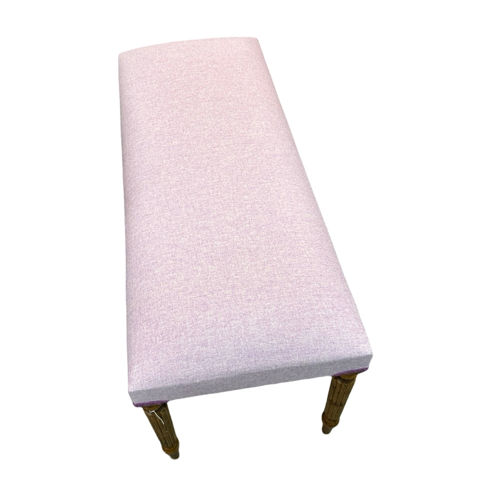 The top of a rectangular wooden bench covered in lavender wool mix fabric with mahogany stained legs.