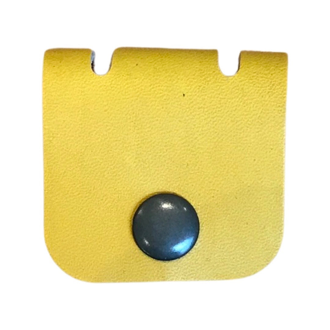Leather cable organiser in yellow.