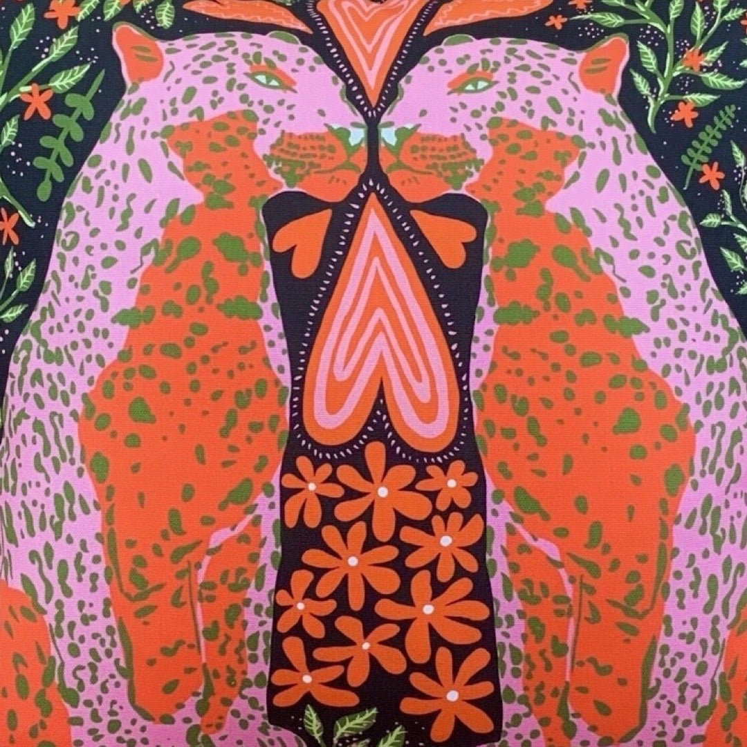 A gorgeous cushion cover with an illustration of leopards in love in red, pink and green.