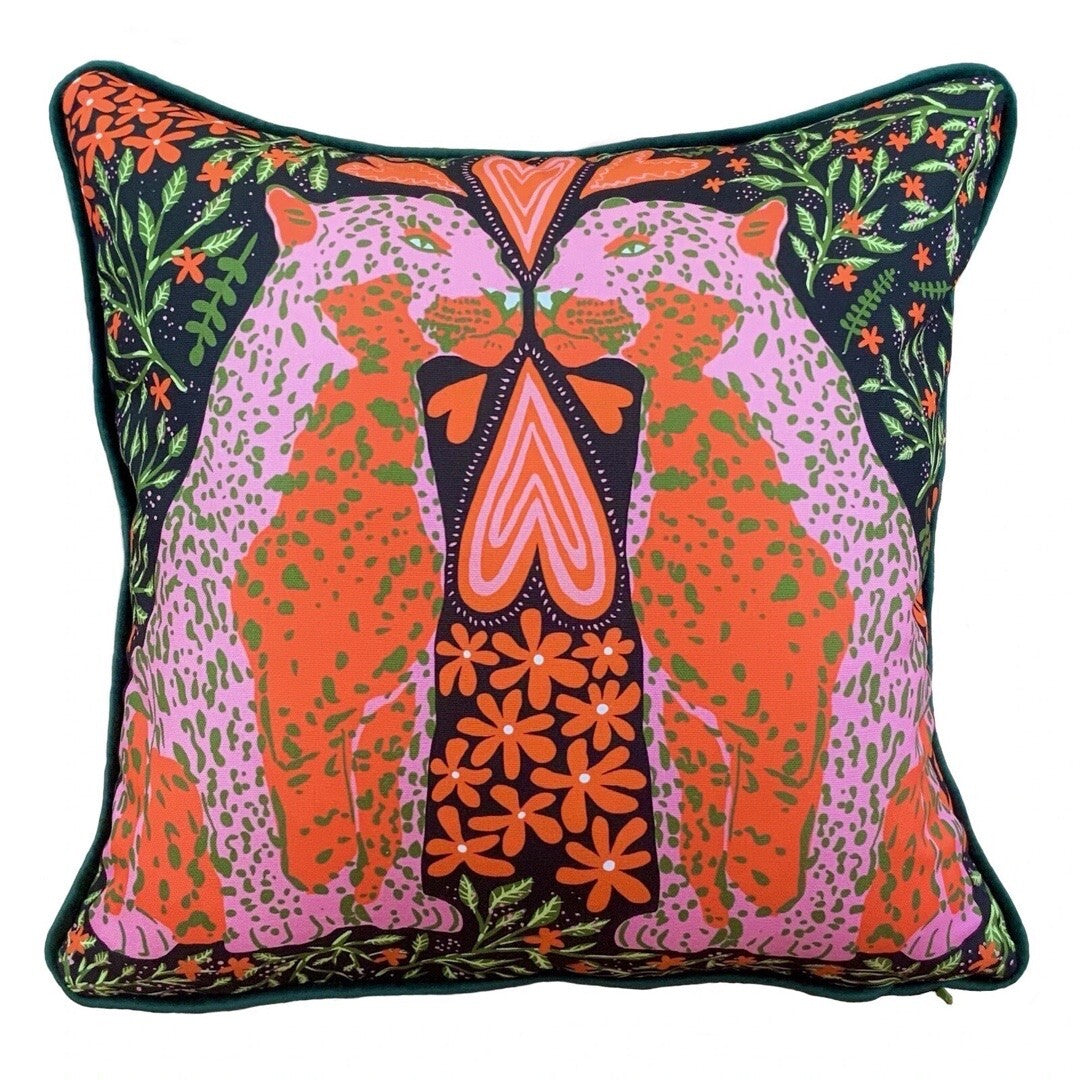 A gorgeous cushion with an illustration of leopards in love in red, pink and green.