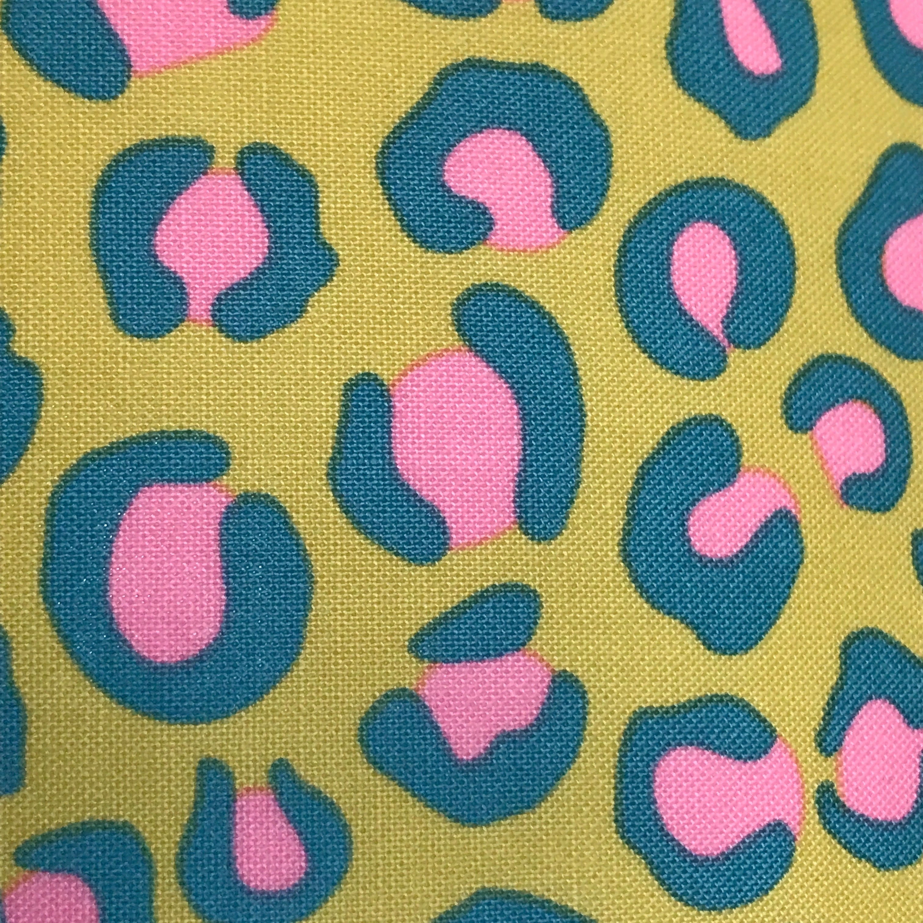 Bright yellow leopard print cotton fabric with pink and blue detail