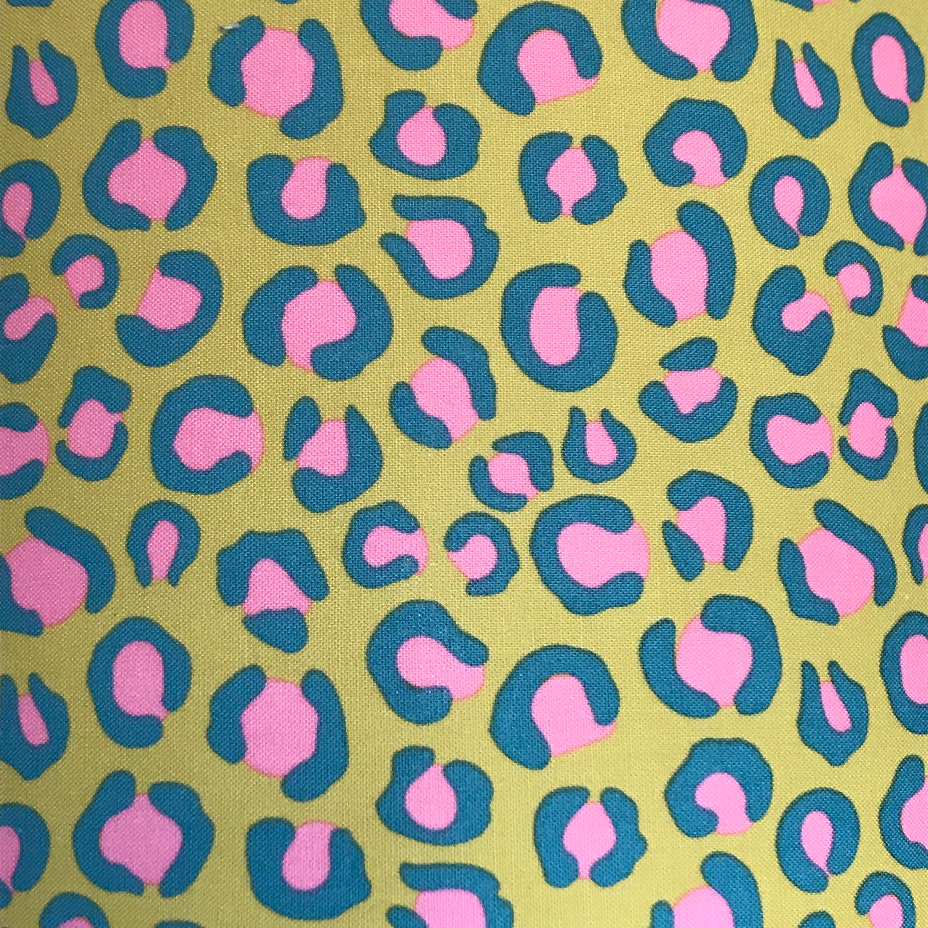 Bright yellow leopard print cotton fabric with pink and blue detail