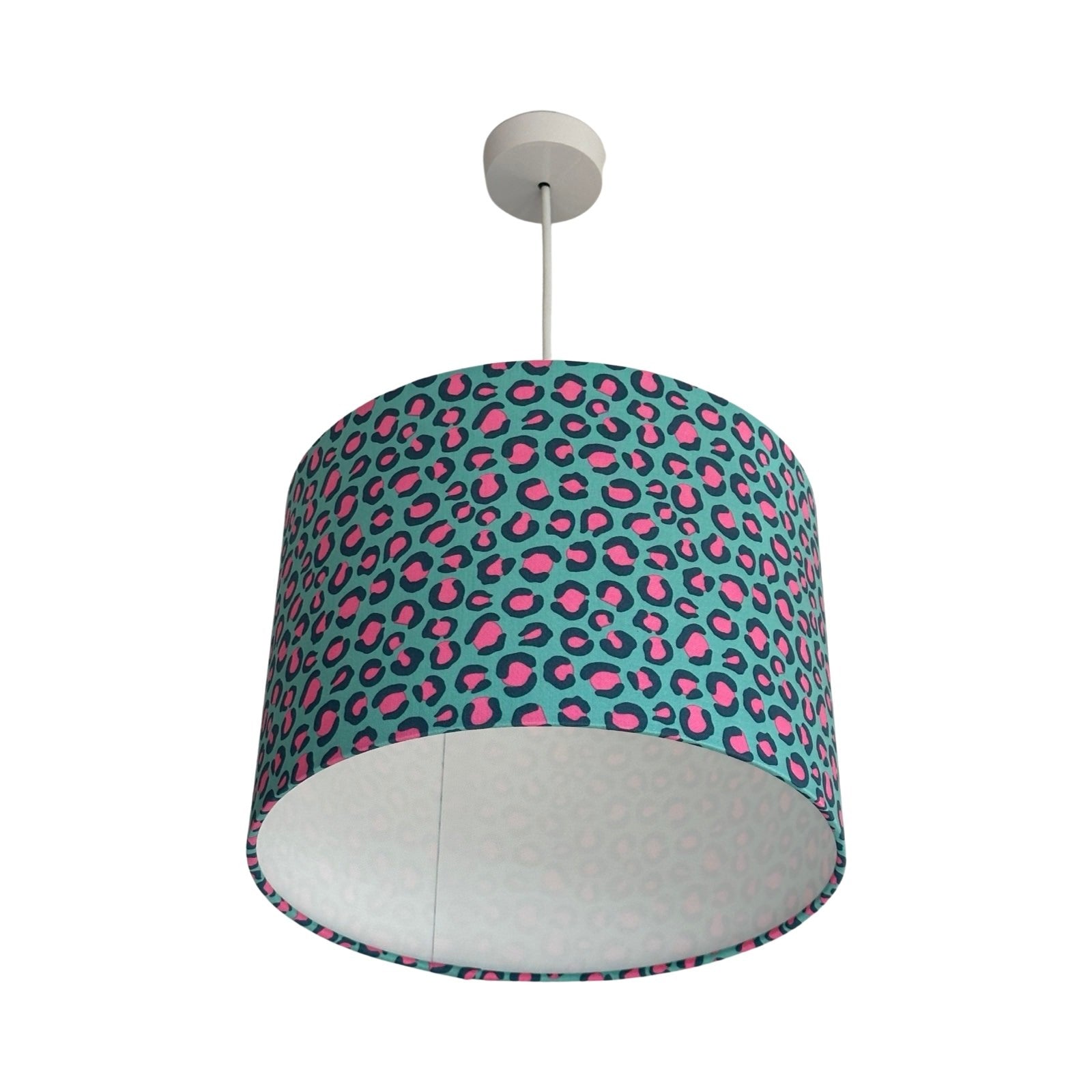 Dum lampshade covered in turquoise leopard print cotton fabric with pink and blue detail