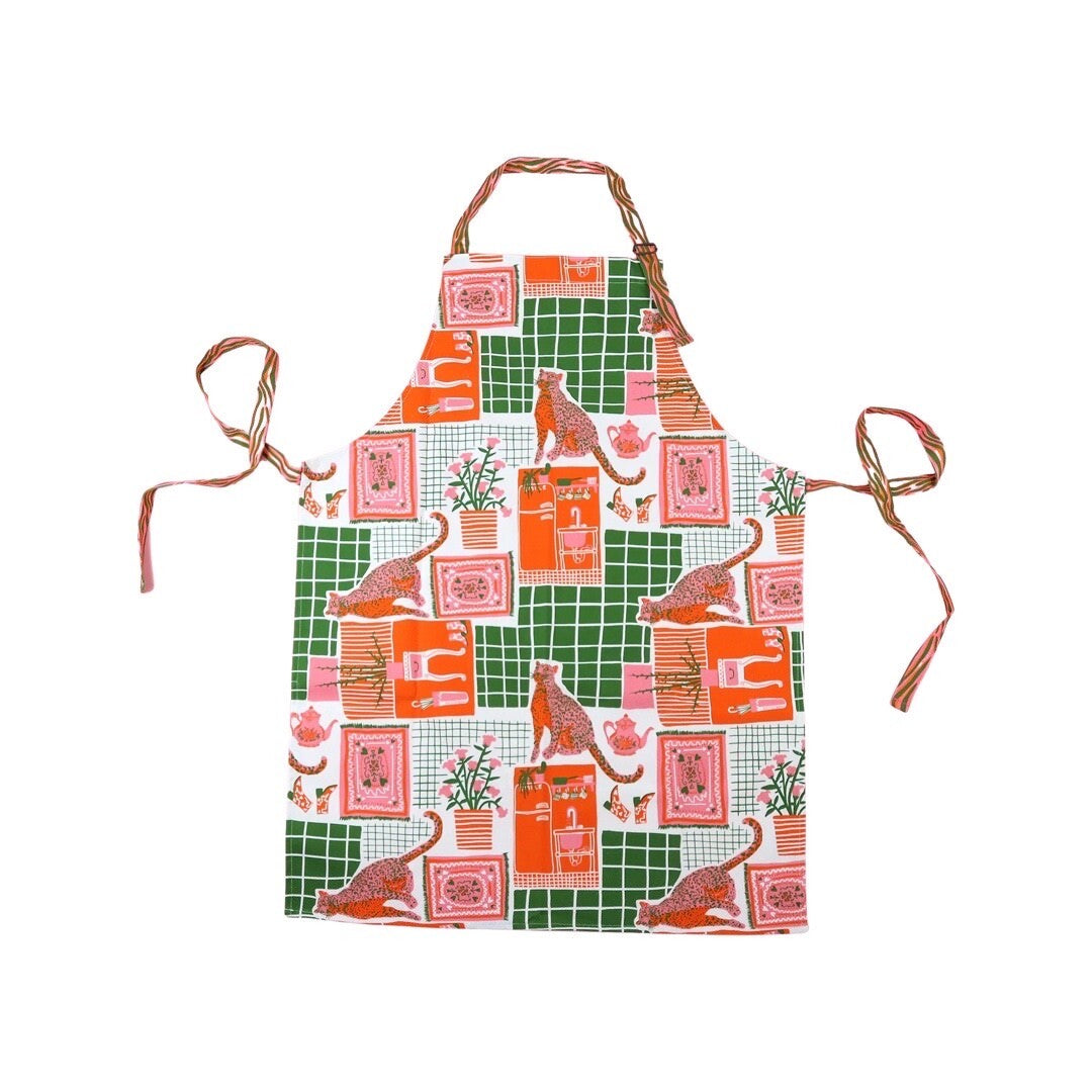 Beautiful kitsch apron featuring a design of leopards at home.