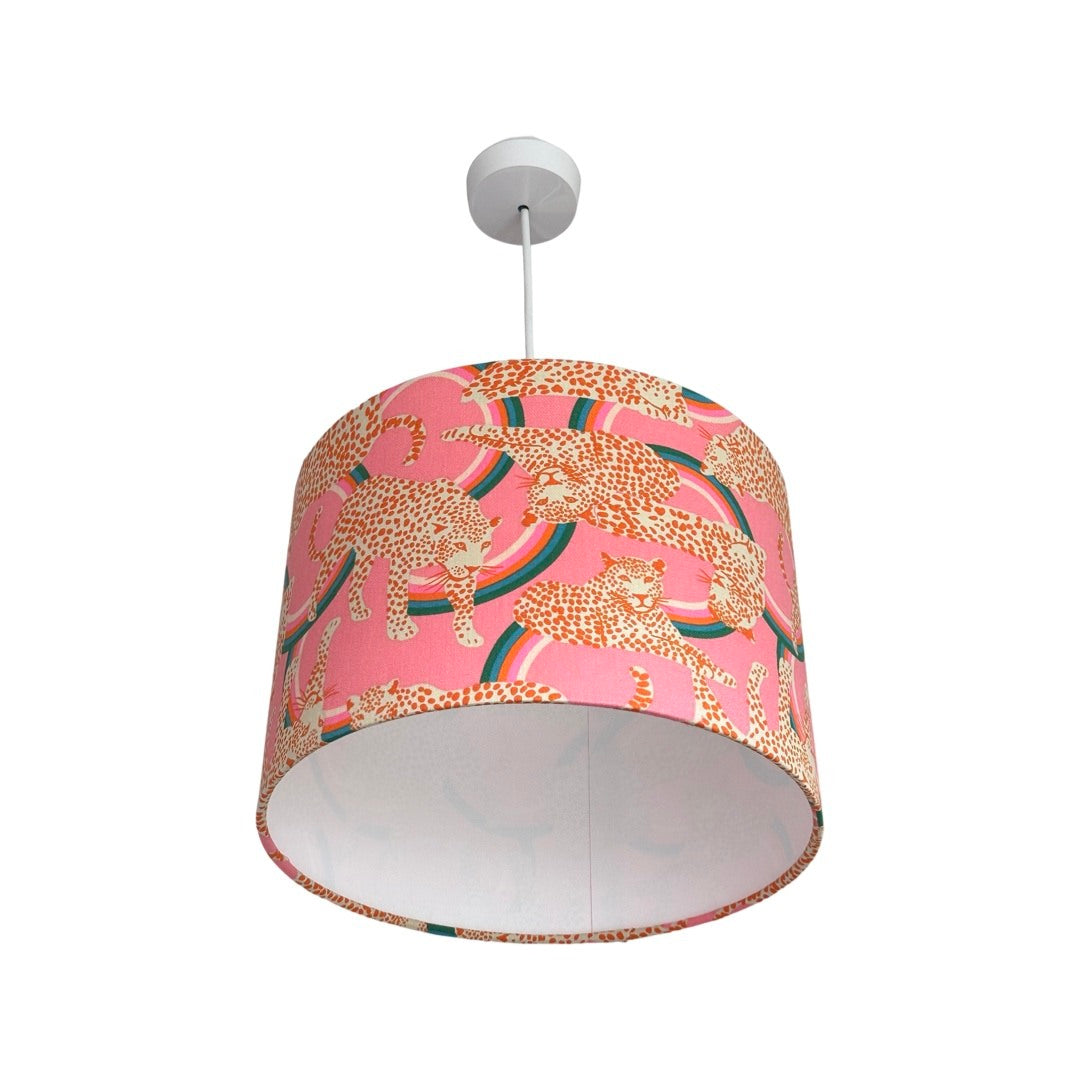Leopards drum lampshade covered in canvas fabric with white and red leopards on a pink and red background