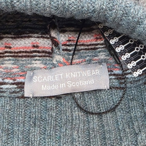 This blue, navy, pink and white striped woollen hat is handmade using only the softest Scottish spun lambswool.