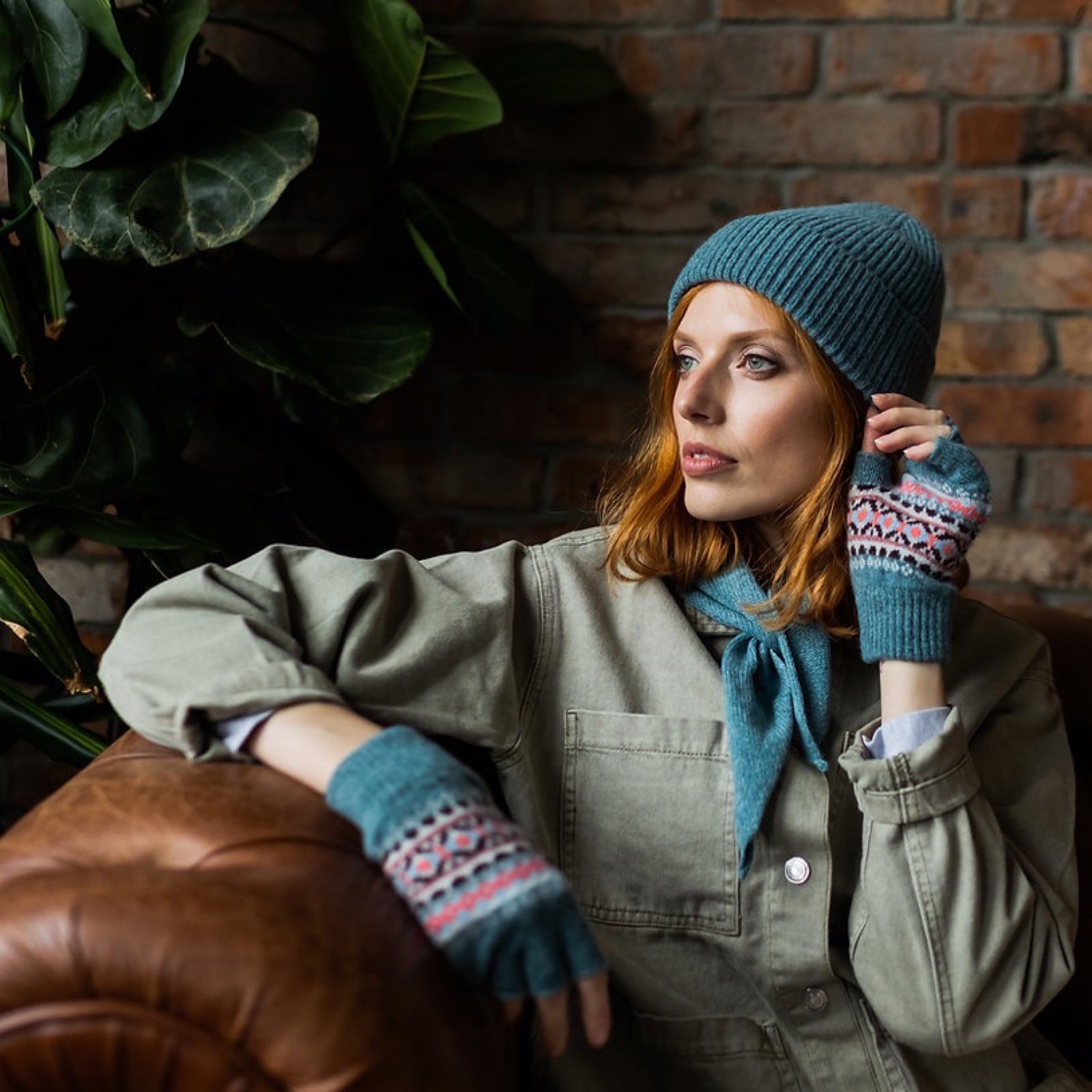 Ladies' denim coloured fingerless gloves with a contemporary pattern in pink, navy and white are made from 100% lambswool.
