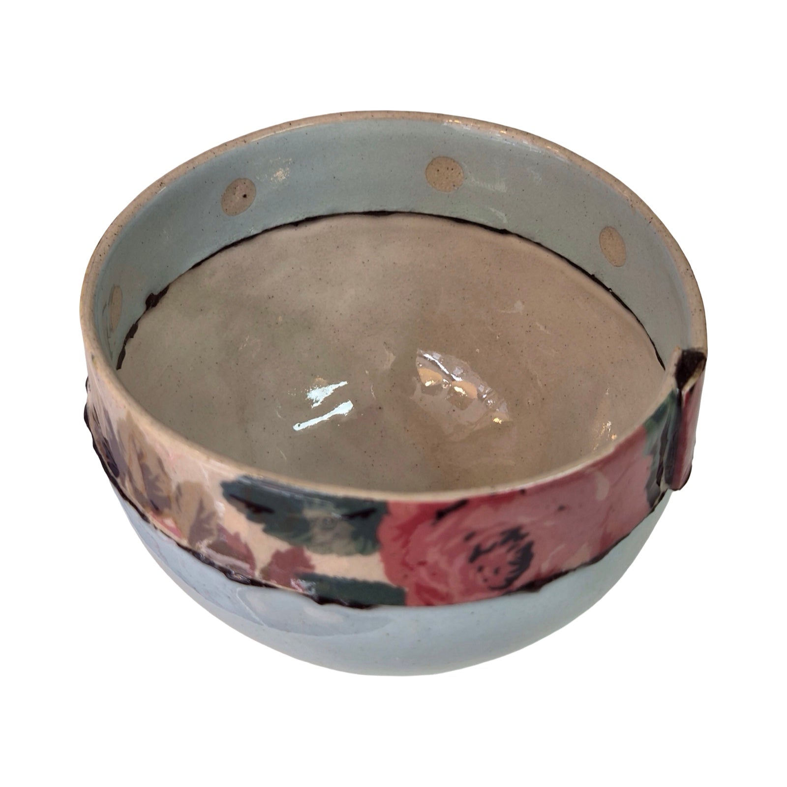 Ceramic bowl with floral design on a white background.