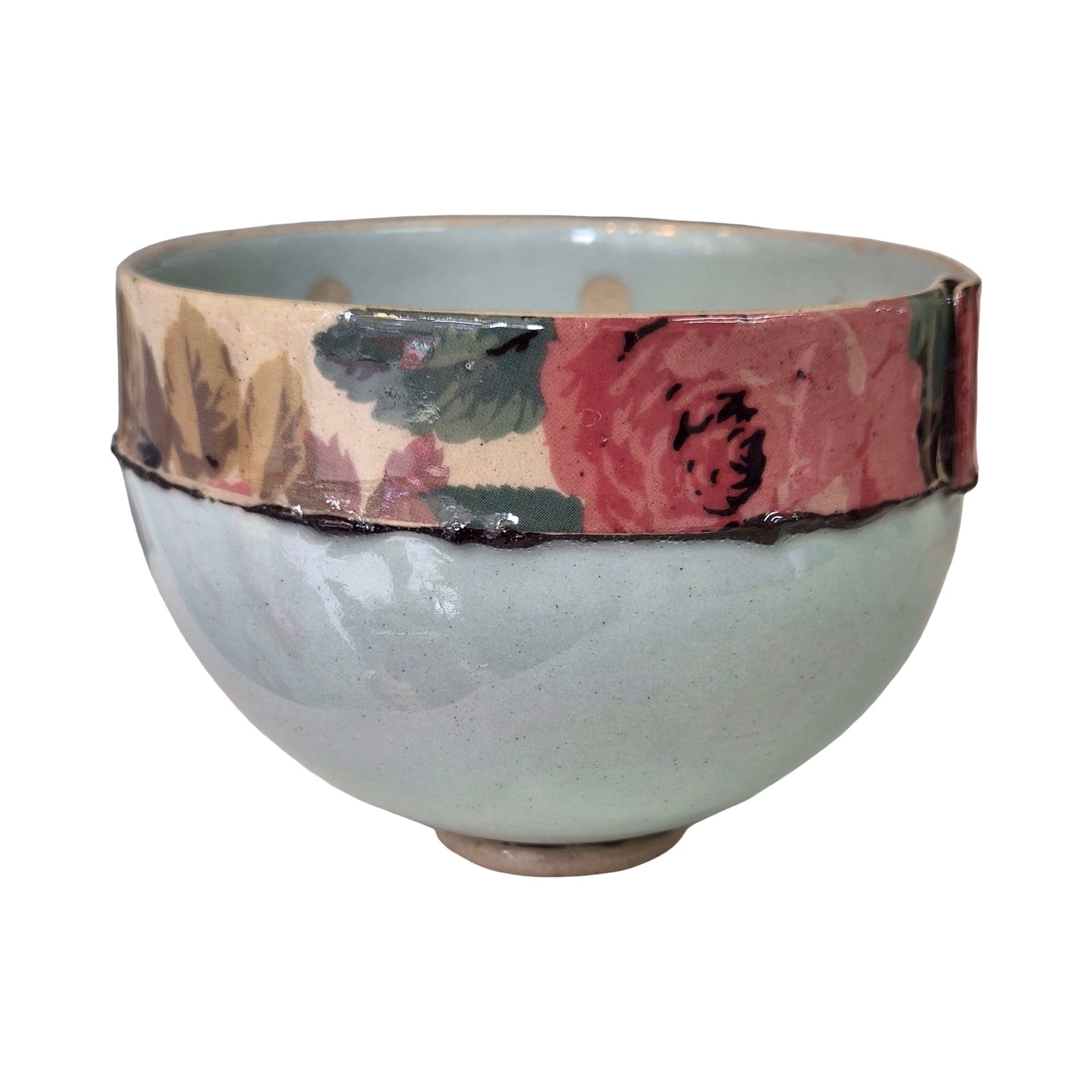 Ceramic bowl with floral band on a white background.