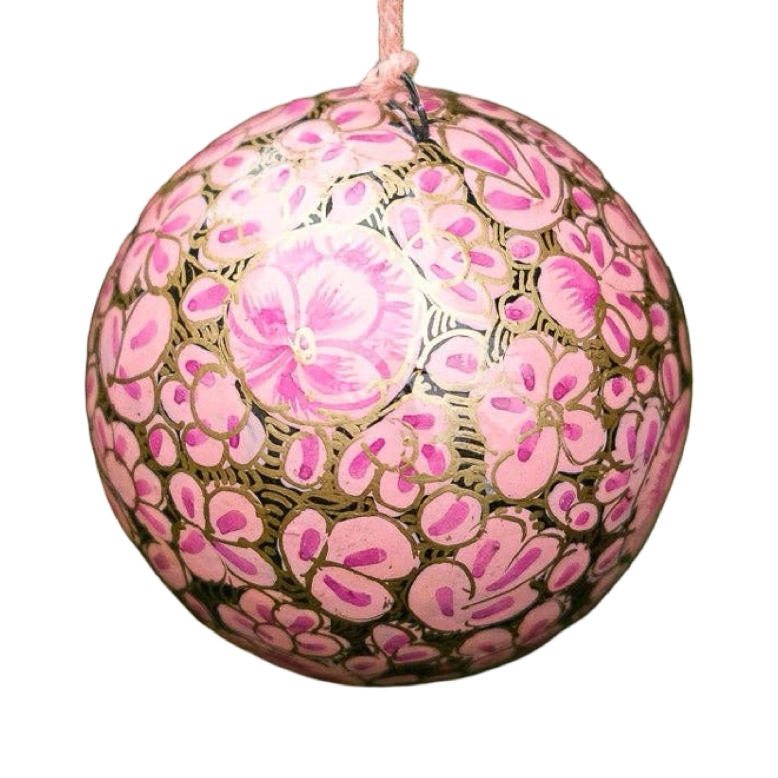 A round papier mache bauble in black with a lilac and gold floral design.
