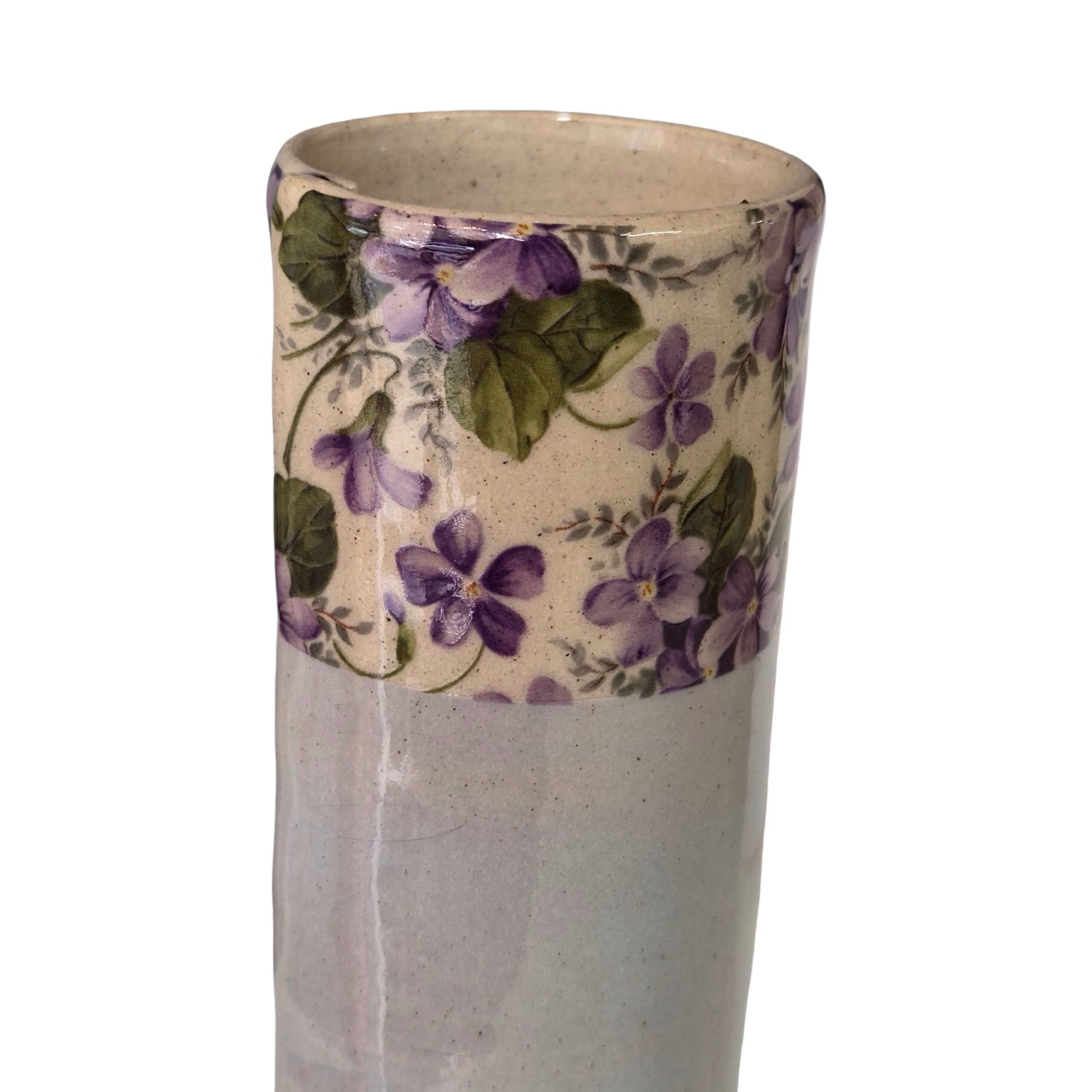 Ceramic vase with floral design on a white background.