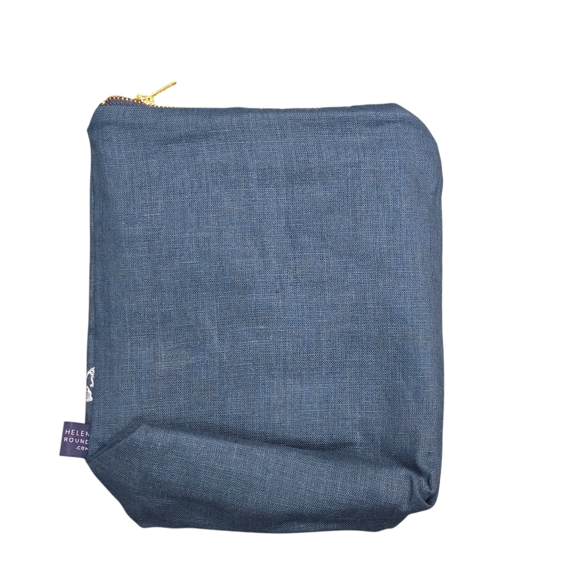 Screen-printed linen toiletry bags with a soft waterproof lining and a brass zip.