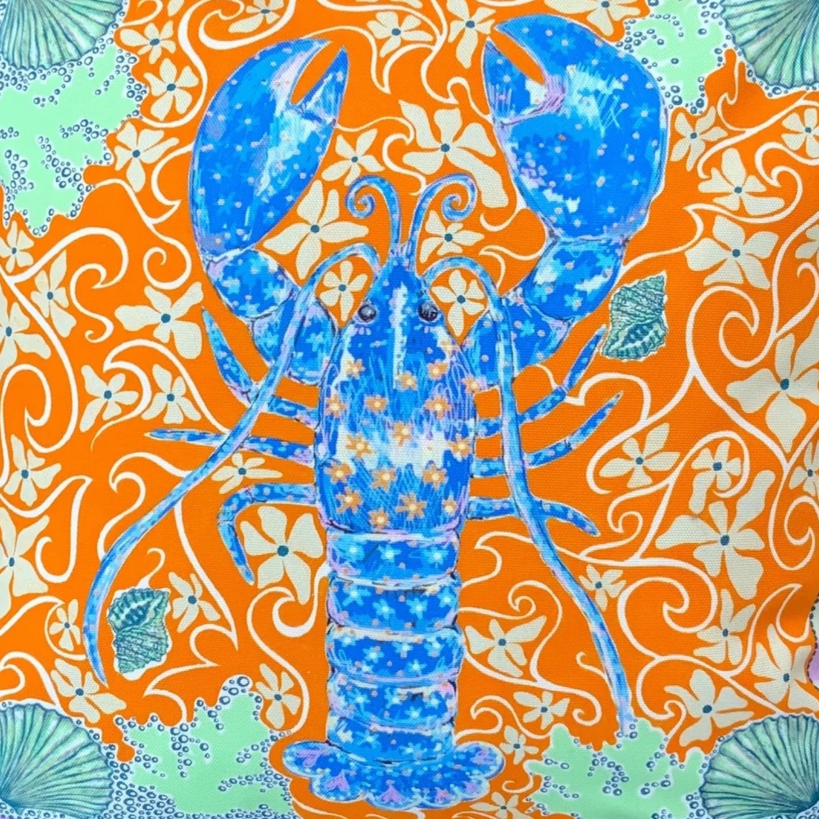 Blue lobster on an orange and green patterned background.
