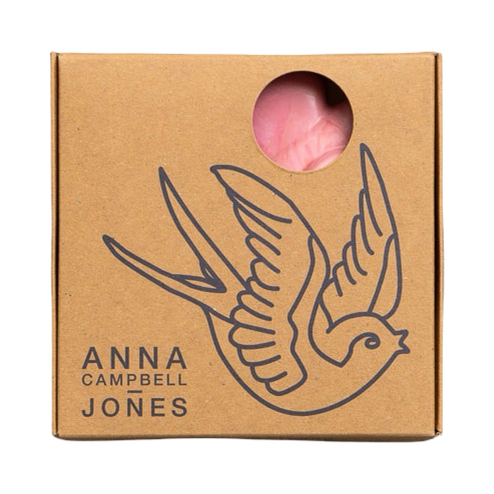 Brown cardboard box with a bird illustration and 'Anna Campbell Jones' branding, containing a pink product.