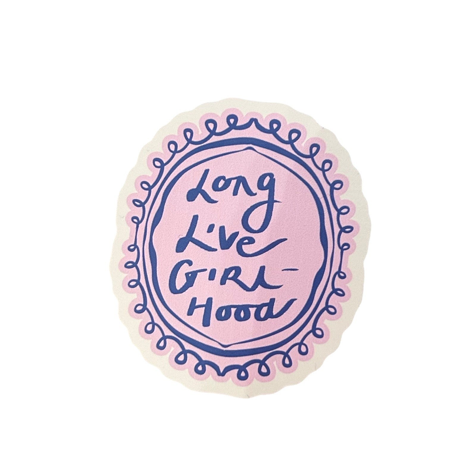 A round, scalloped-edge sticker with a light pink centre, navy blue hand-lettered text reading 'Long Live Girl Hood,' and a decorative navy border with pink inner accents, shown on a plain white background.