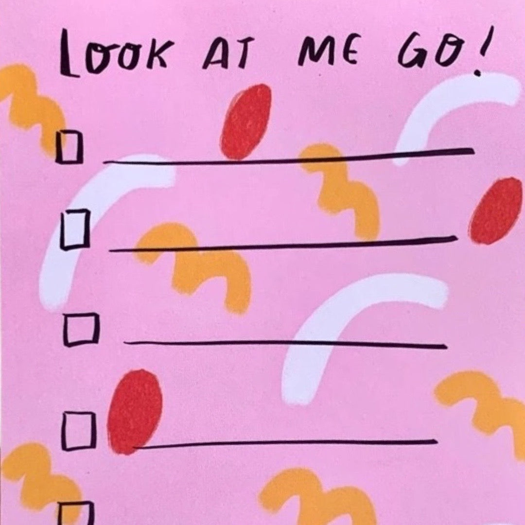 Colorful list pad with pink background and red, white, and orange shapes and text that reads 'Look At Me Go, I'm on Fire!'