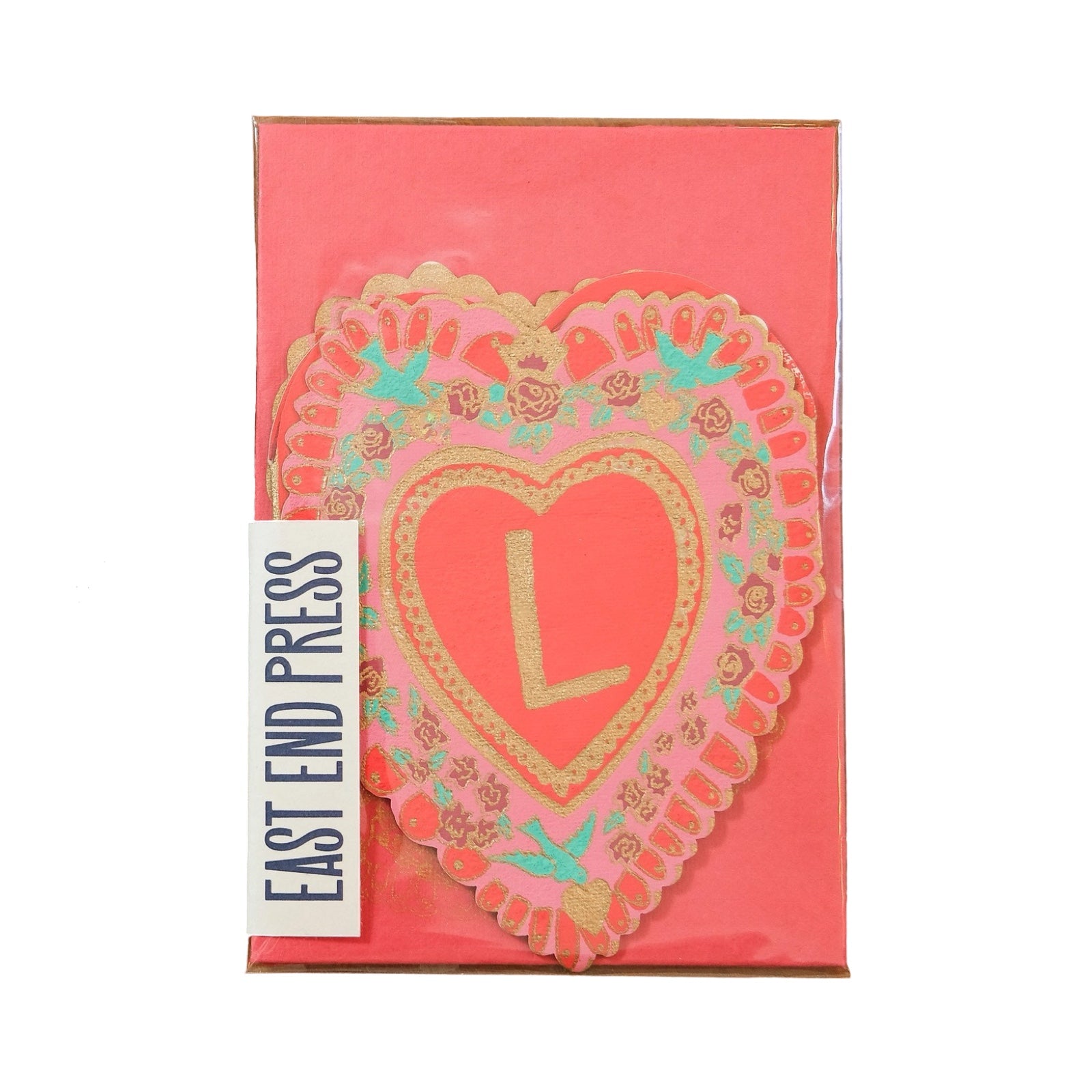 A red and pink heart-shaped concertina card with the letter L in the centre with a red envelope.