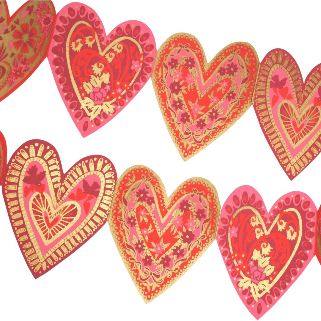 A red, pink and gold love heart-shaped concertina garland.