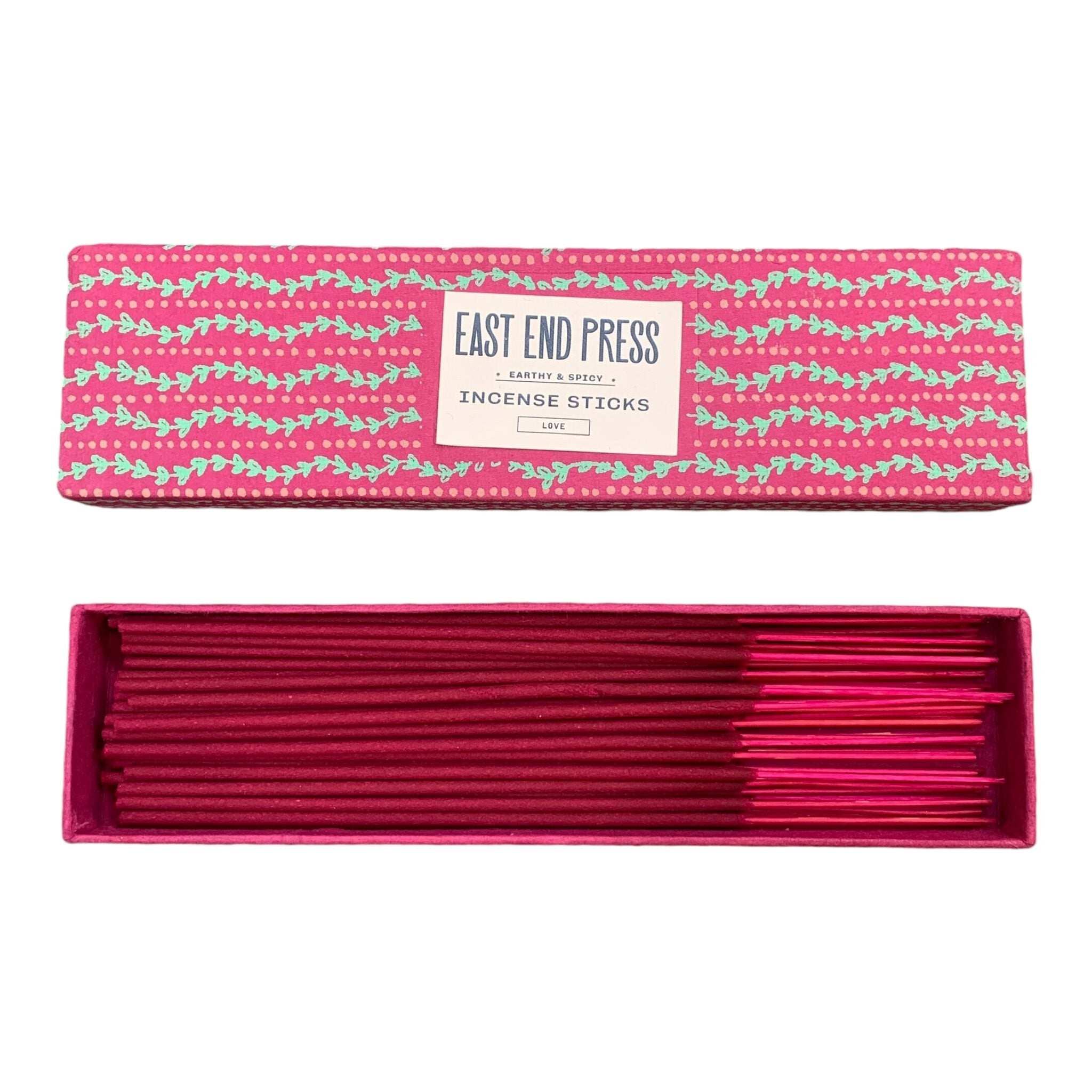 Pink box with green wavy lines holding love incense sticks.