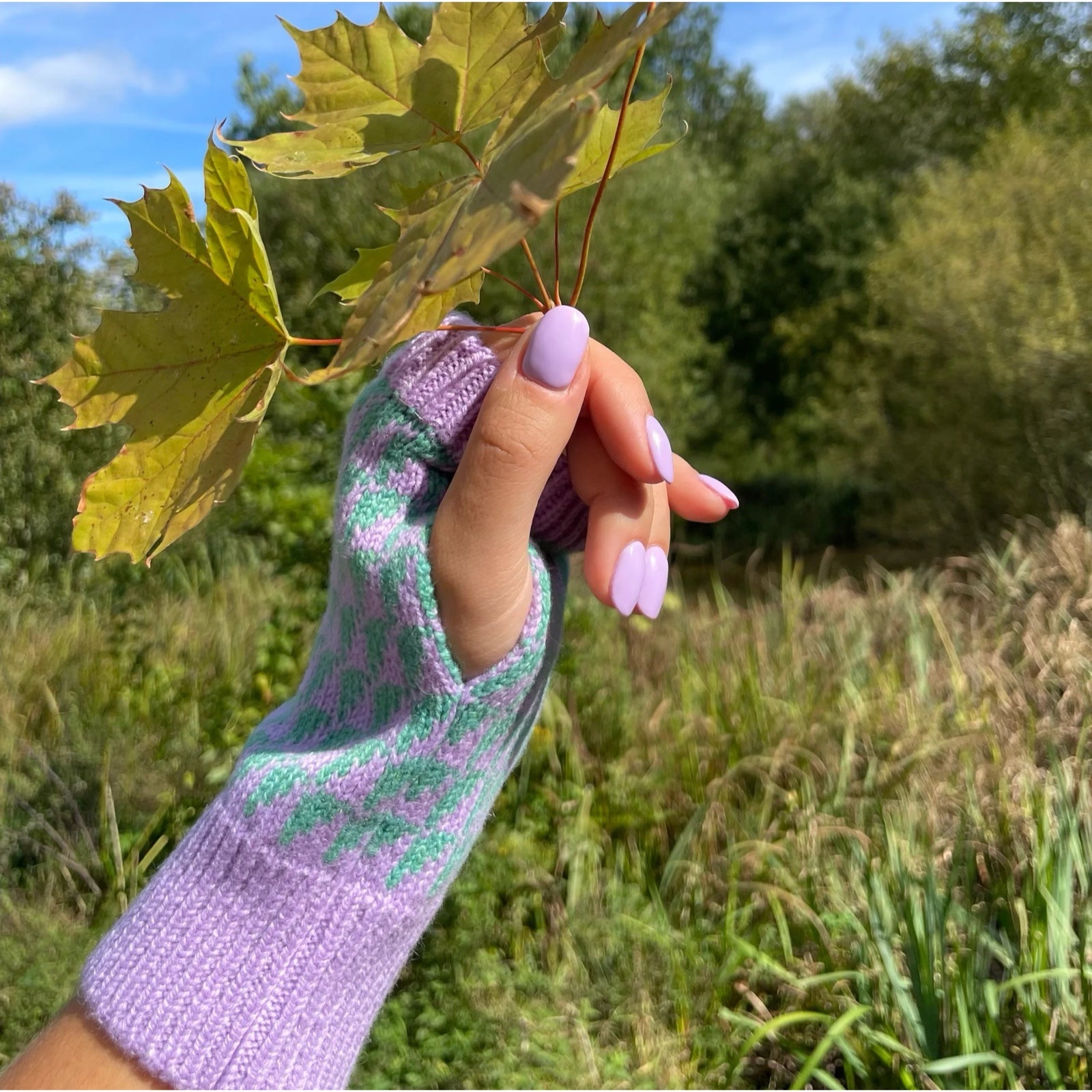 Lupin purple and green patterned wrist warmers have a matching lupin cuff and trim.