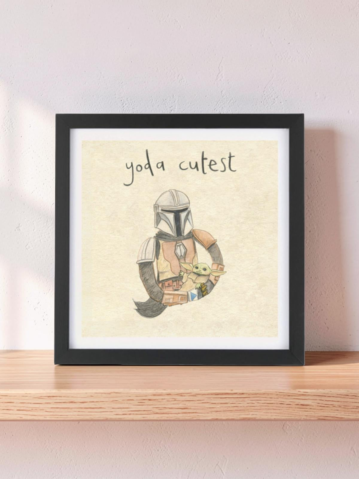 Illustrated print of Mando the bounty hunter carrying baby Yoda and the text 'Yoda Best'.