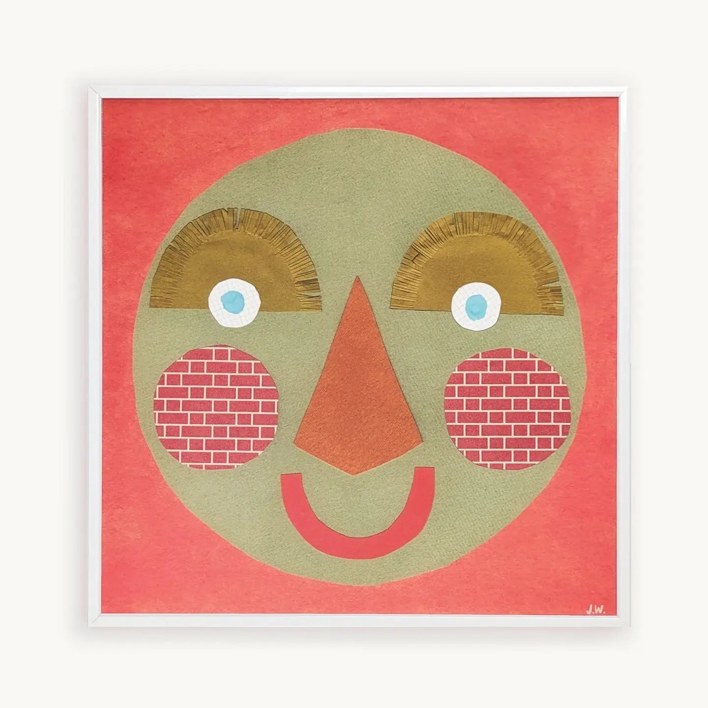 Framed artwork of a stylised face with a red background.