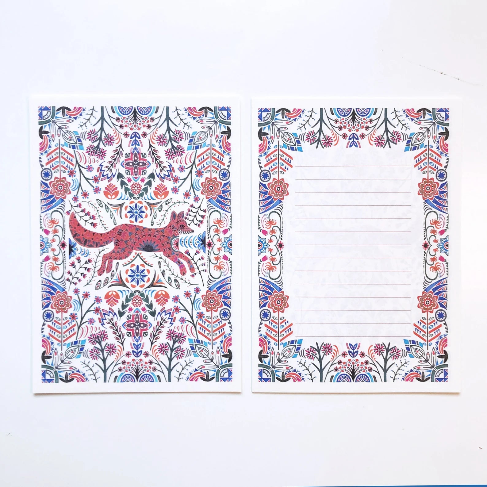 Two decorative notebooks with floral and animal patterns on a white background.