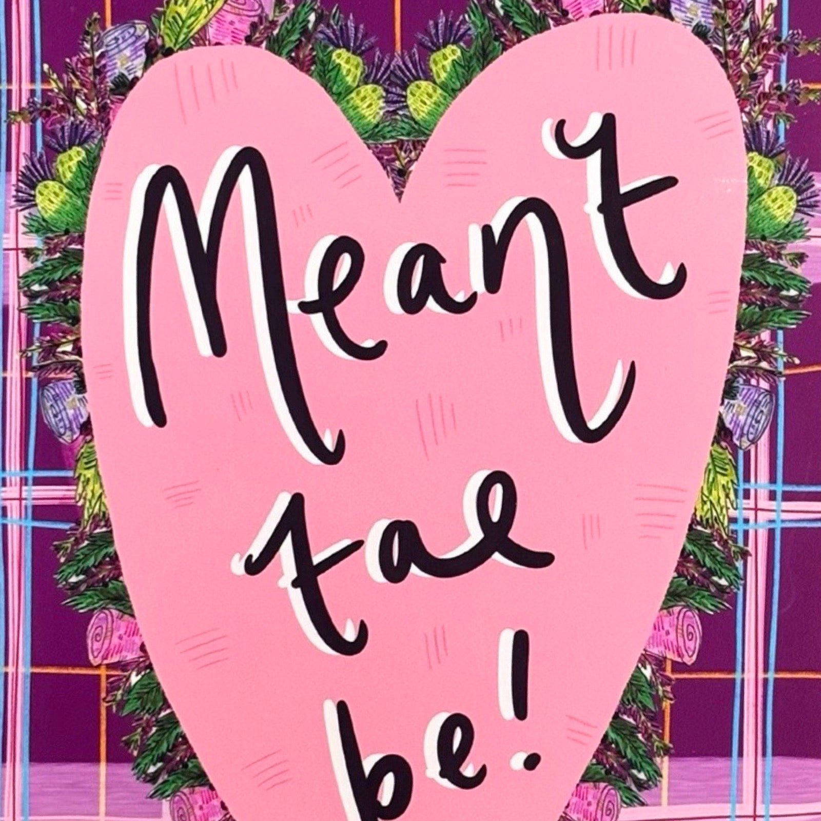 Greeting card with pink heart and 'Meant to be!' text on a tartan background.