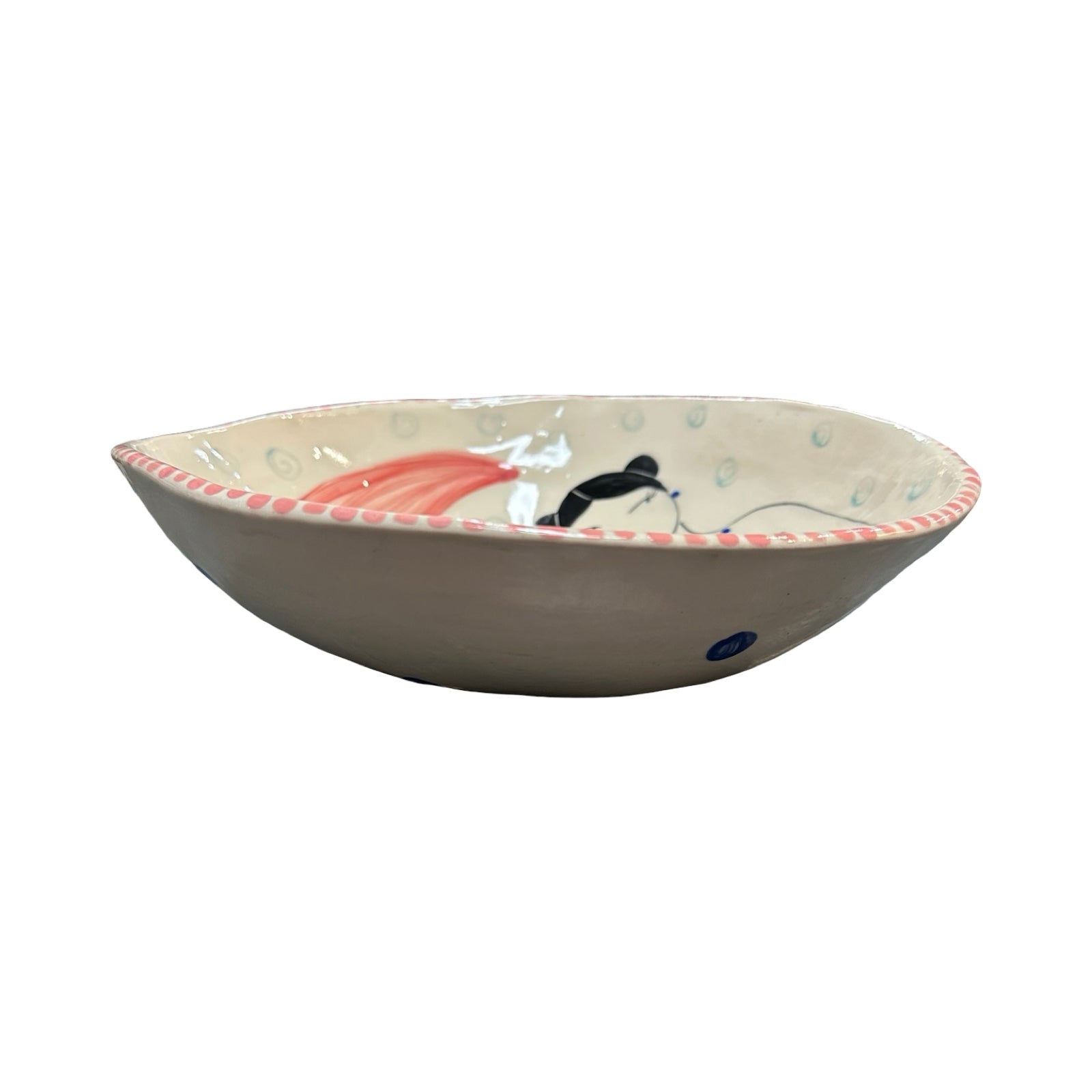 Ceramic bowl with decorative edge on a white background.