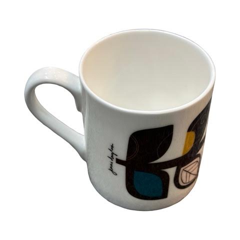 A white fine-bone china mug featuring a midcentury-inspired colourful leaf stem.
