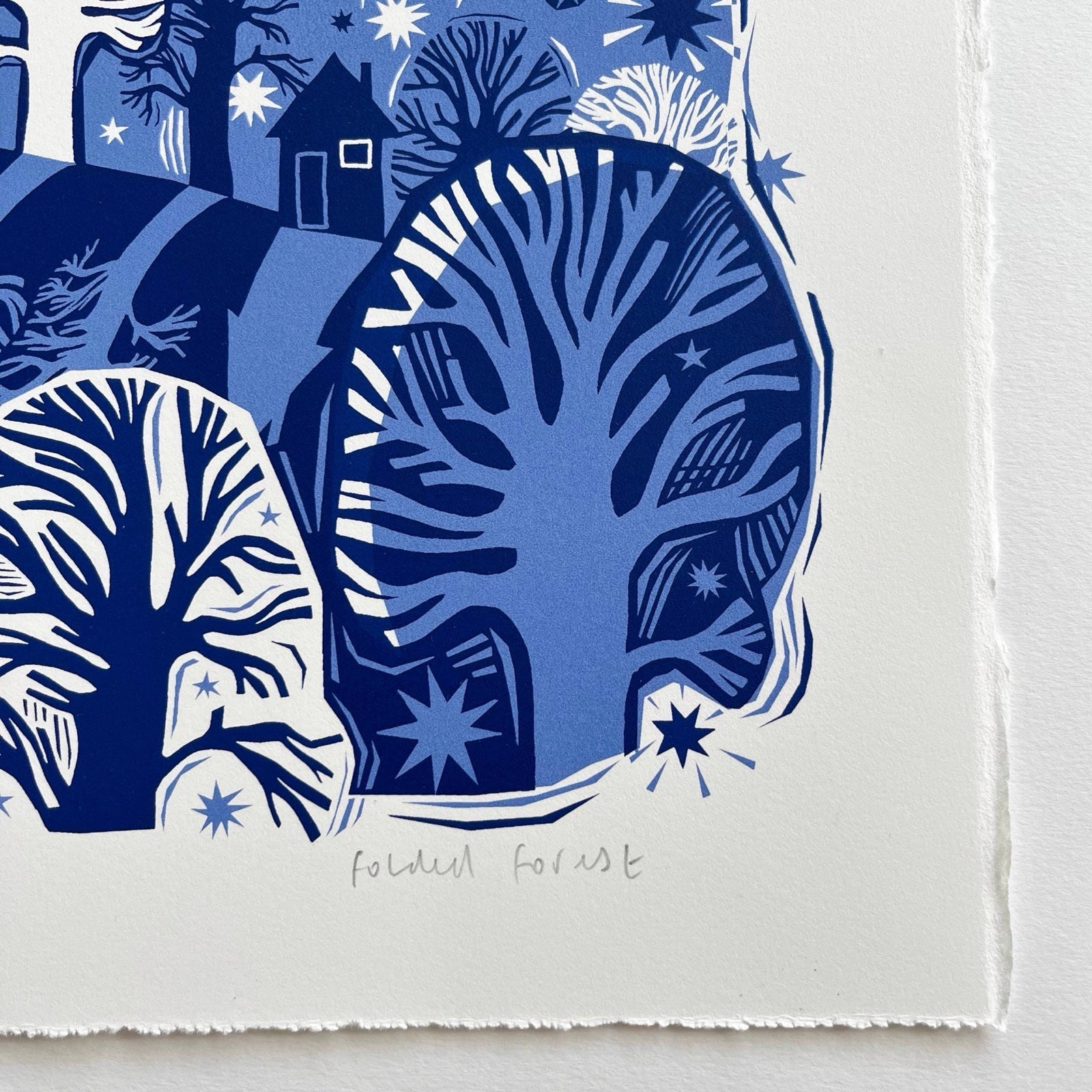 This midnight fox screen print is printed in two shades of blue. It features a fox creeping through a forest with the moon behind, and is printed on hand-torn, thick, satin white paper.