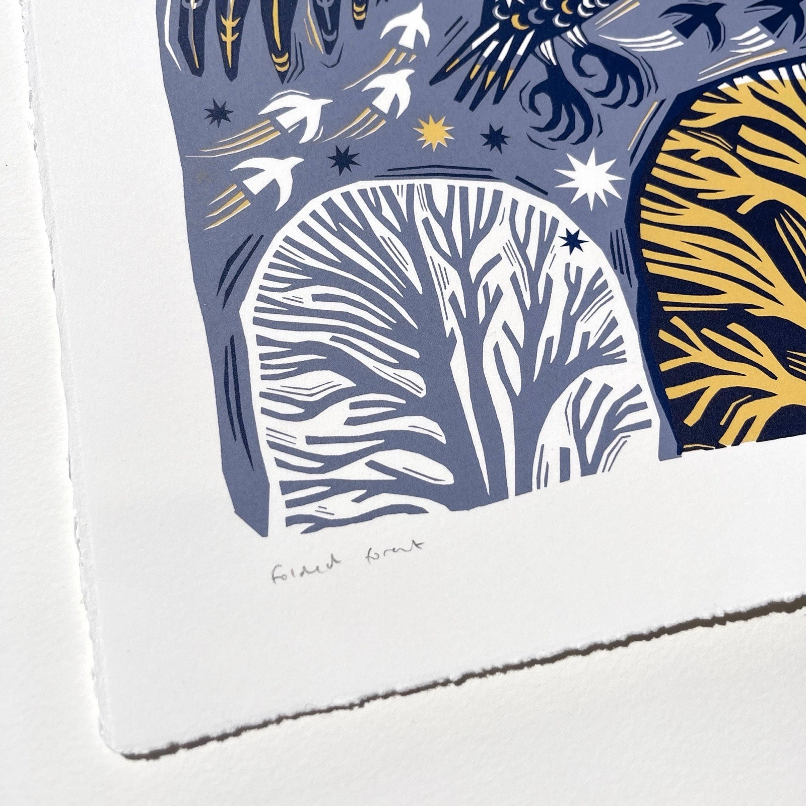 This midnight owl screen print is printed in midnight green and mustard. It features an owl flying over a forest with the moon above and is printed on hand-torn, thick, satin white paper.