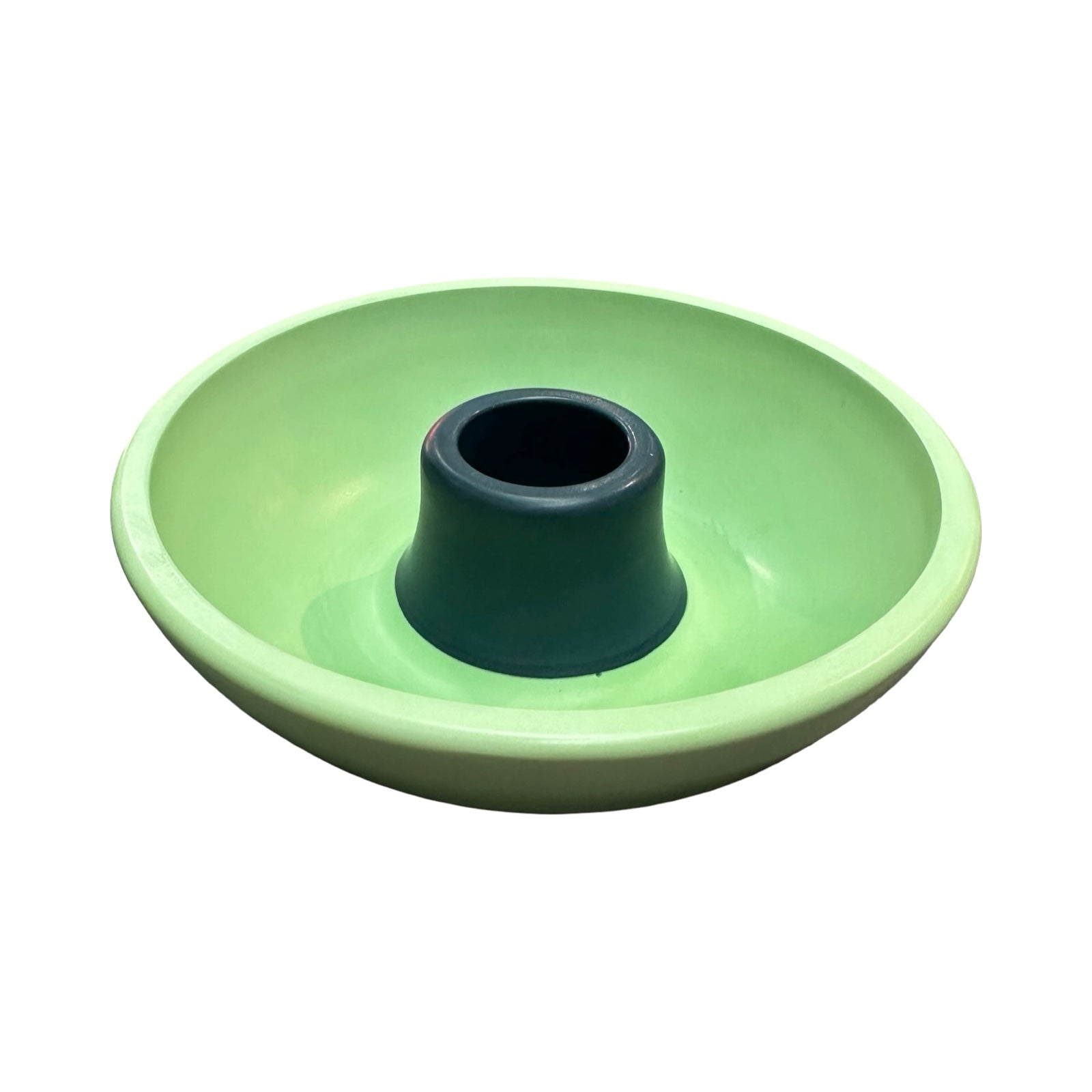Green ceramic candle holder with a navy centre on a white background.