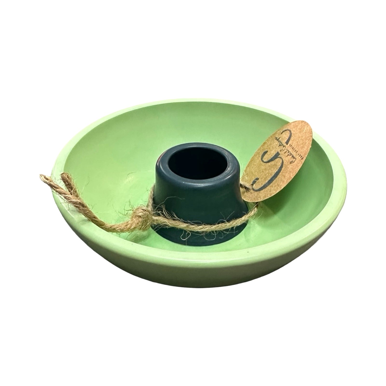 Green ceramic candle holder with a navy centre on a white background with tag.