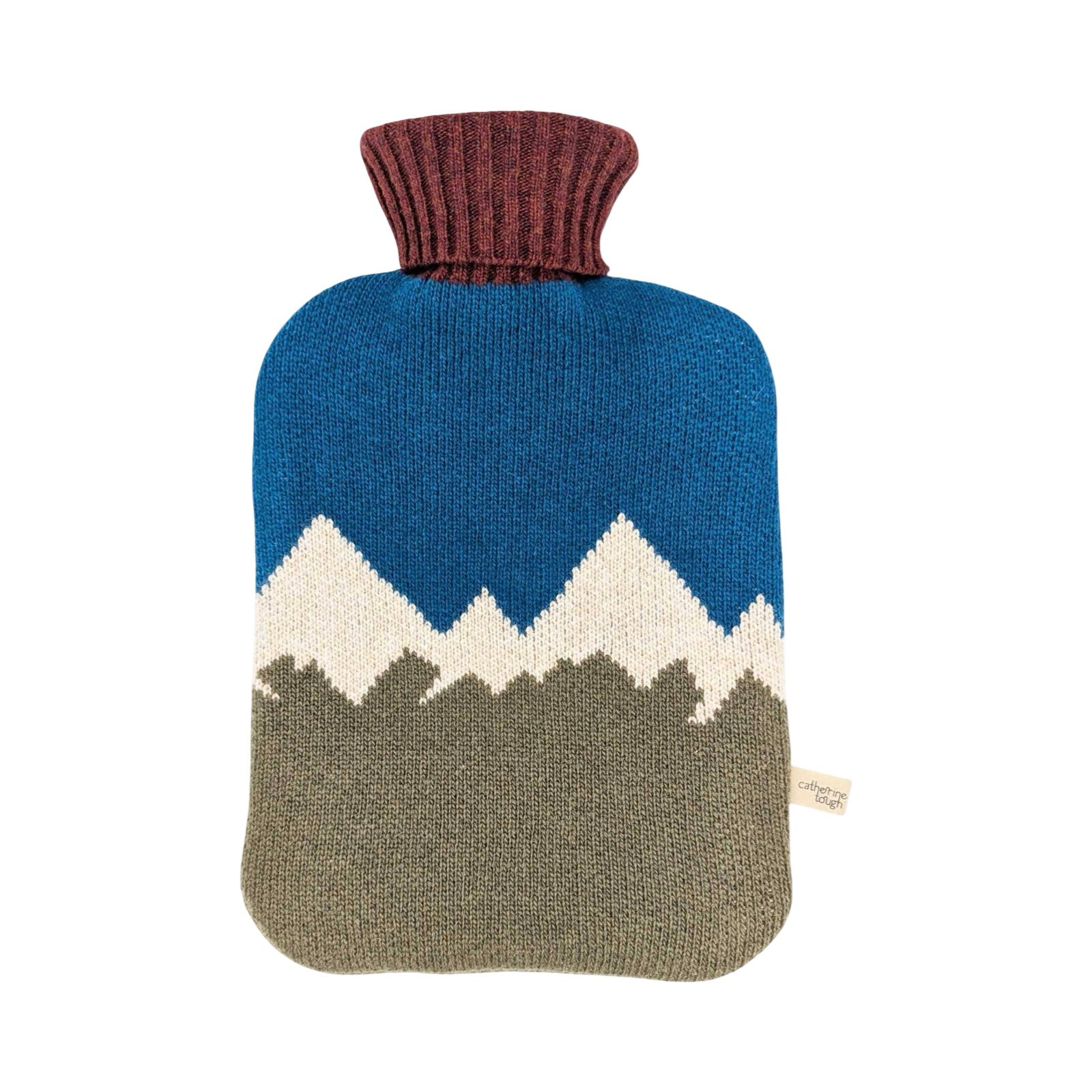 A knitted hot water bottle cover featuring a mountain design with a blue sky, white peaks, and an olive green base, finished with a ribbed burgundy neck.