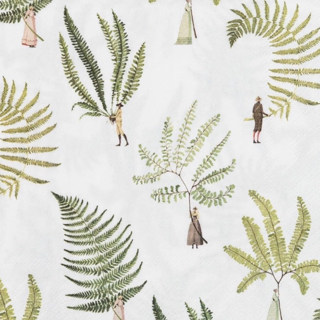 Patterned napkin with green fern leaves and small figures on a white background.