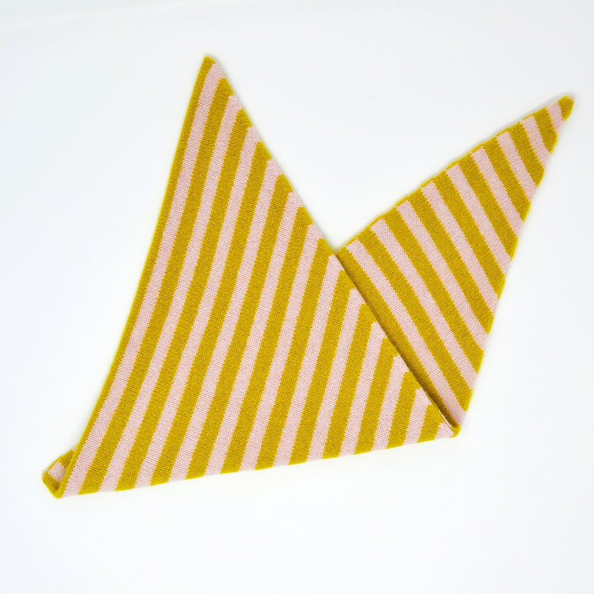 Yellow and pink striped fabric folded into a triangle on a white background.