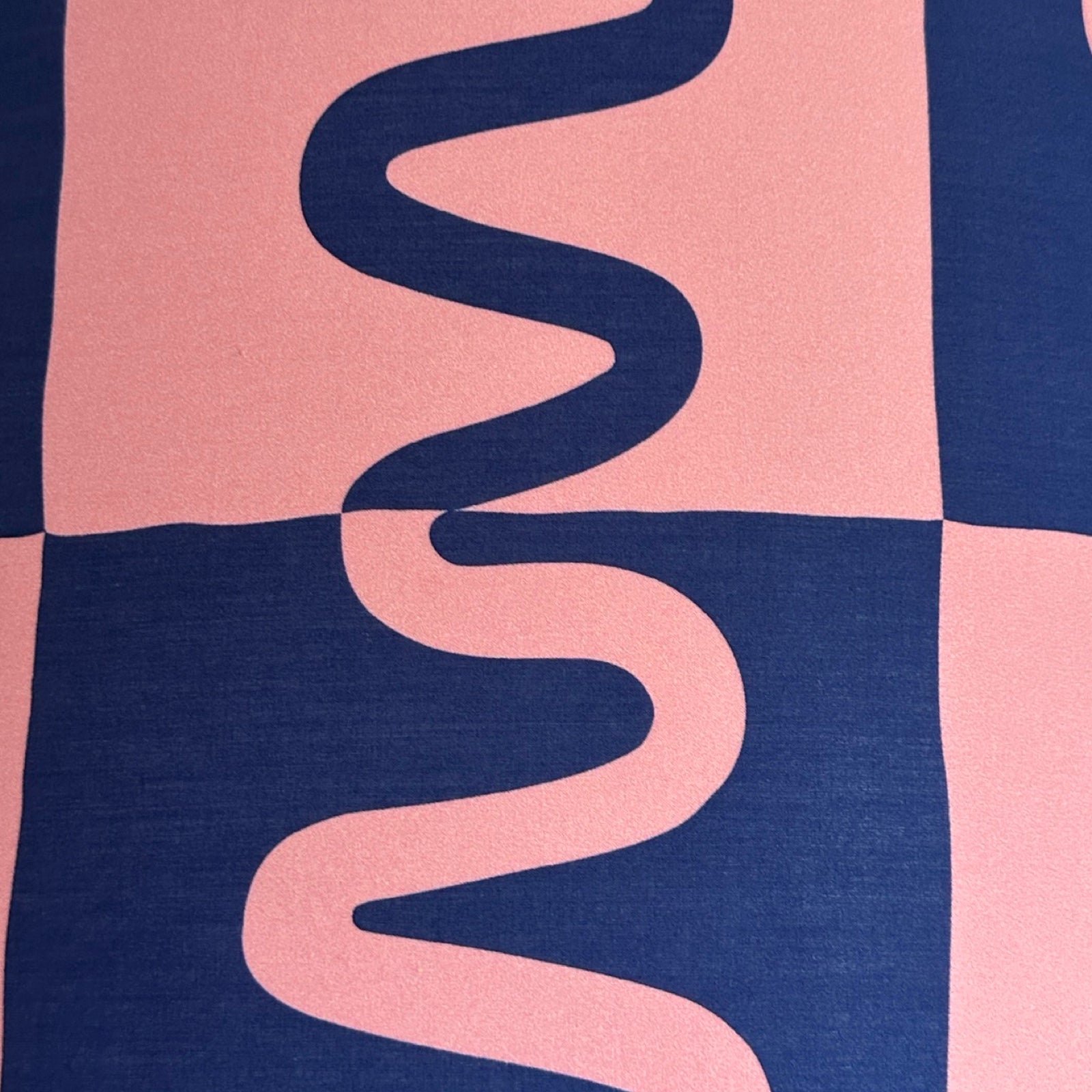 Striking pink and blue cotton fabric with squiggles running through contrasting squares.