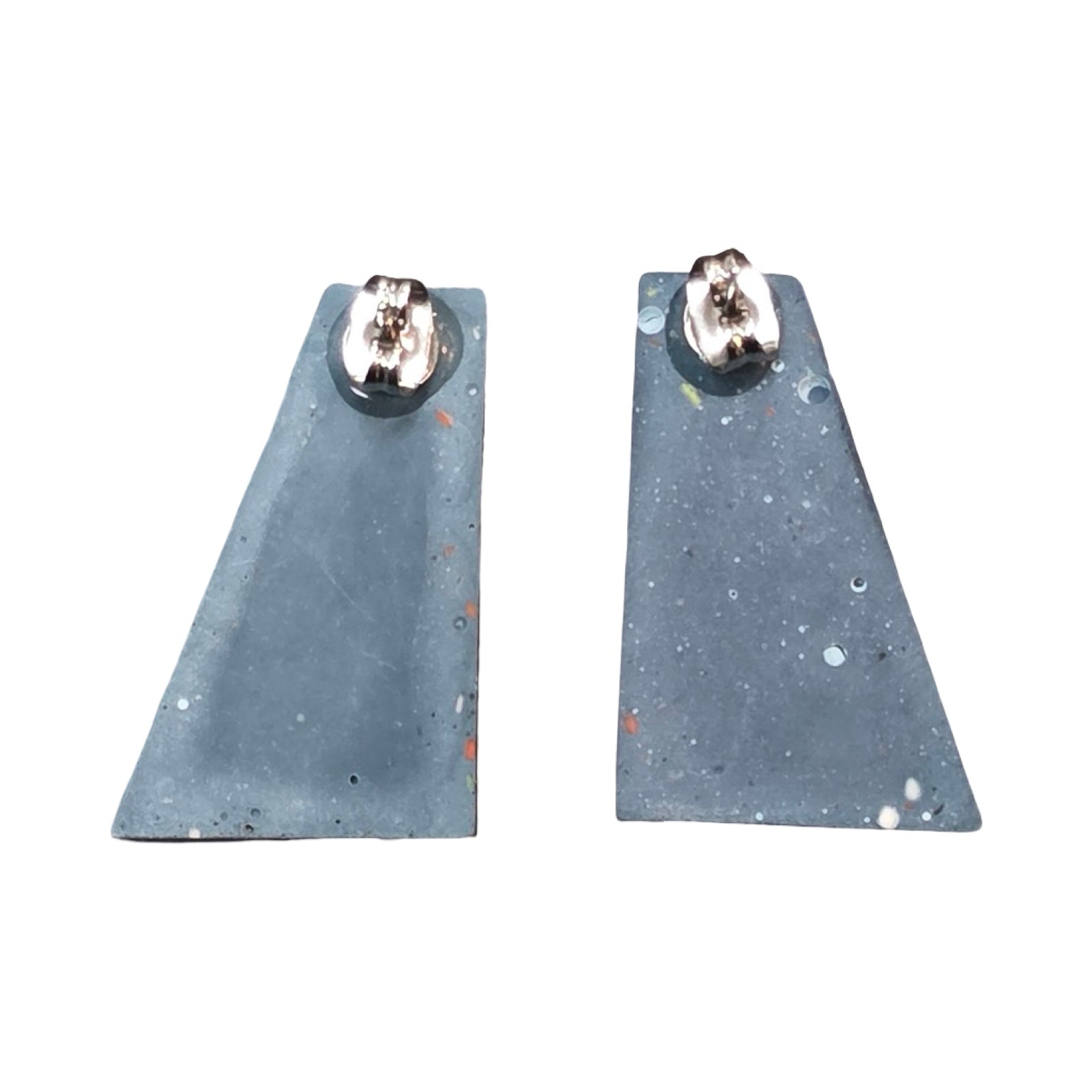 Navy trapezoid-shaped stud earrings with a white grid pattern.
