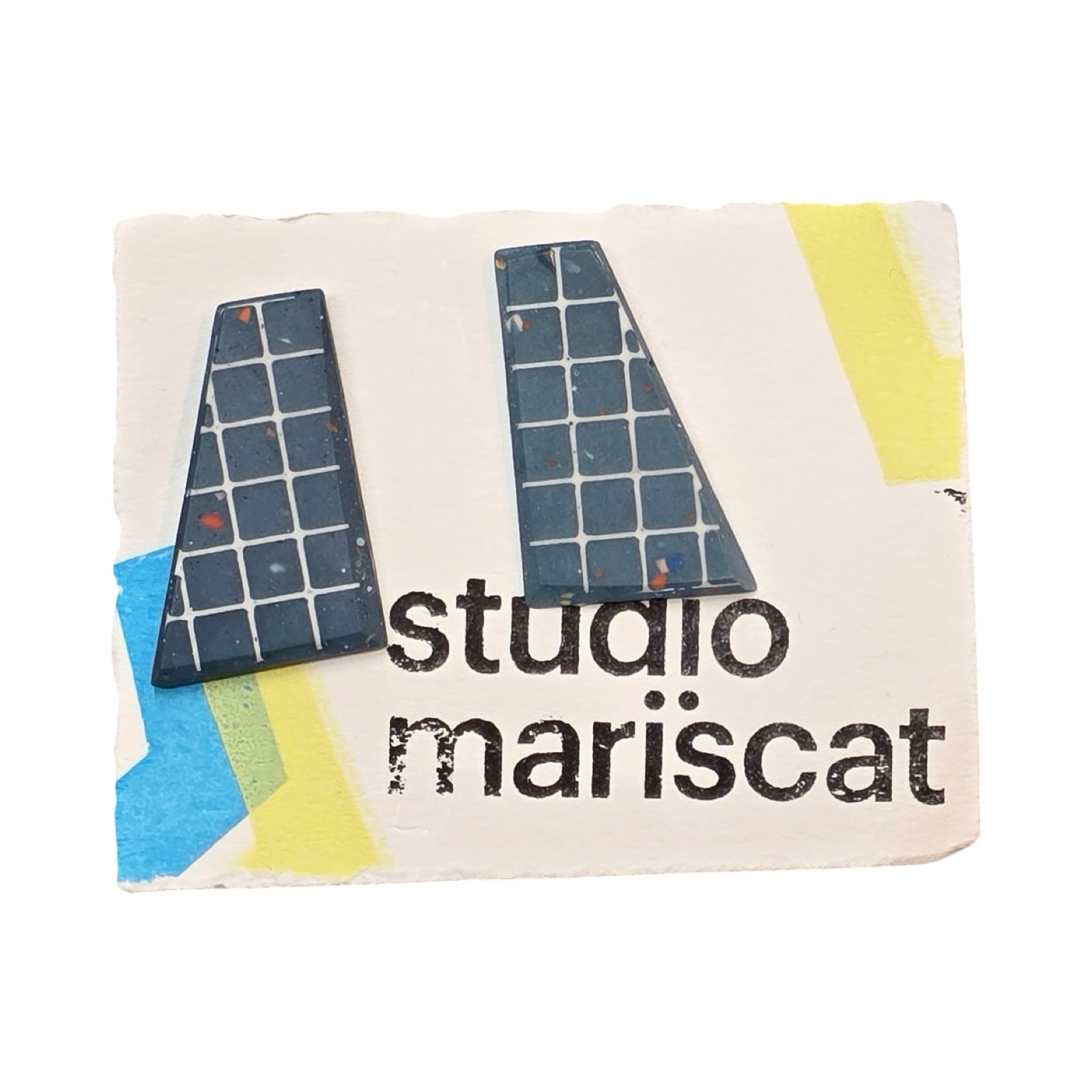 Navy trapezoid-shaped stud earrings with a white grid pattern.