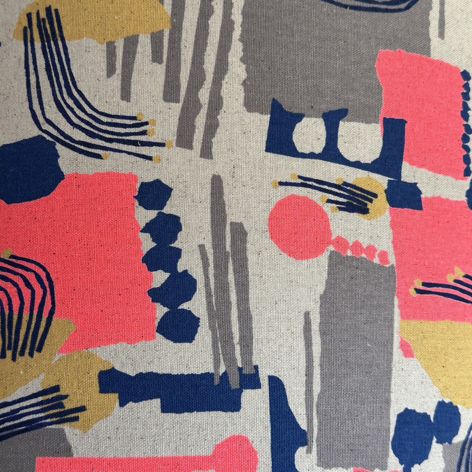 Cotton/linen blend fabric with an abstract shapes pattern in neon pink, navy, gold and grey.