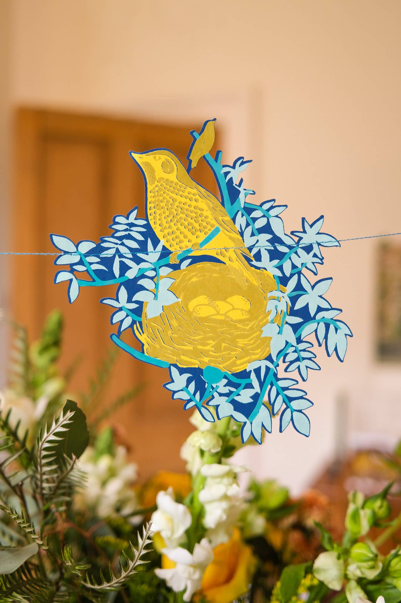 This beautiful nest garland features ten screen-printed bird nests full of speckled eggs, flowers and twigs.