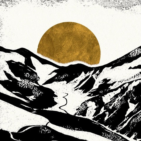 Black and white print featuring a group of hikers climbing up a mountain path in the snow, and a mustard-coloured sun setting behind the mountains.