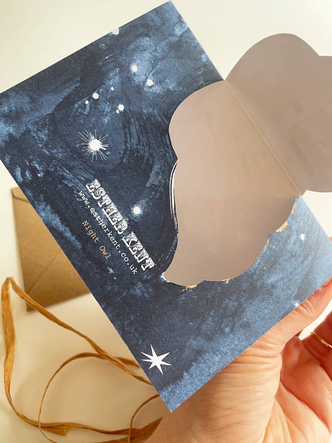 Back of card with a starry night design and visible brand name.