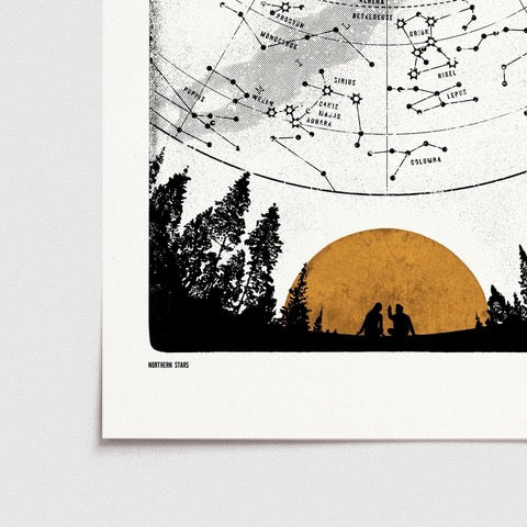 Black and white print featuring the northern lights mapped out in the sky, and a mustard-coloured sun setting behind the mountains.