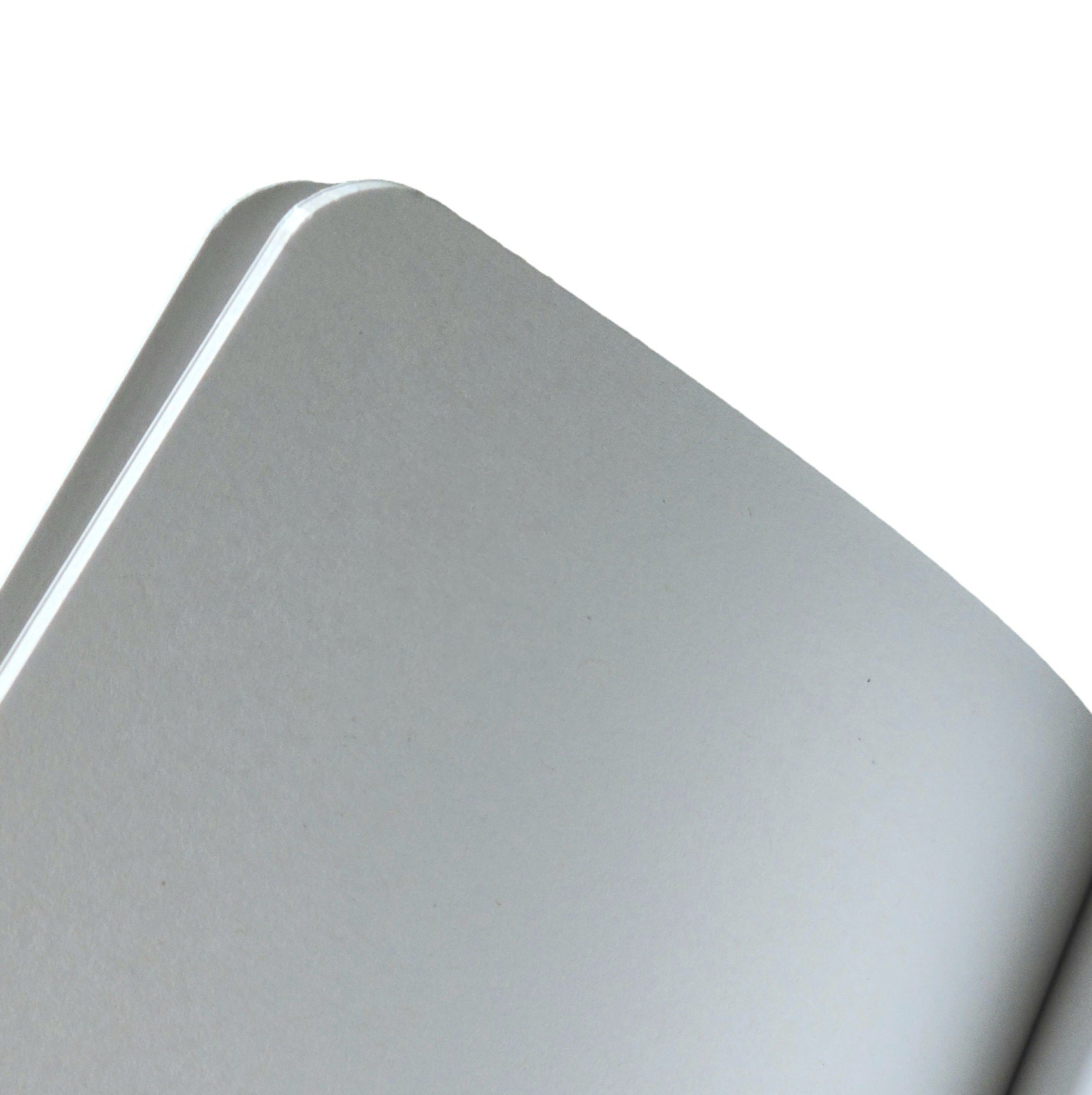 A close up picture of the blank pages in a notebook.